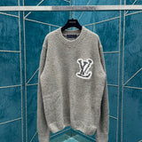Back view of Louis Vuitton luxury clothing with label-forward styling
