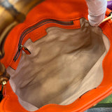 Side profile of statement signature women's handbag – women's designer-style accessory