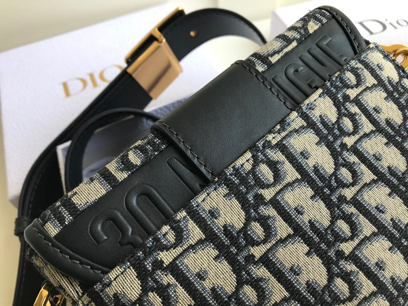 Side profile of polished signature women's handbag – women's designer-style accessory