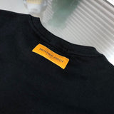 Back view of Louis Vuitton luxury clothing with monogram-inspired silhouette