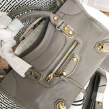 Back view of sleek polished women's handbag – women's luxury accessory