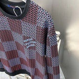 Full styled look of Louis Vuitton luxury clothing with label-forward styling