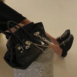 Polished bag shown from front angle