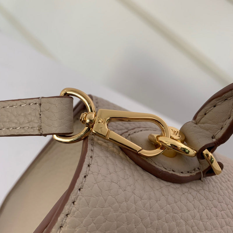 Handle and strap detail of statement everyday-luxe women's handbag – women's designer-style accessory