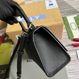 Close-up detail of modern sleek women's handbag – women's statement bag