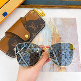 Close-up detail view of Louis Vuitton unisex sunglasses