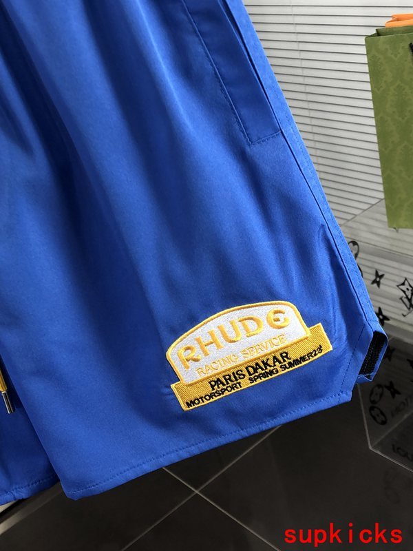 Flat lay presentation of Rhude luxury clothing with streetwear-inspired cut