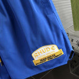 Flat lay presentation of Rhude luxury clothing with streetwear-inspired cut