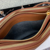 Handle and strap detail of premium signature women's handbag – women's premium purse