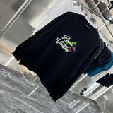 Close-up detail shot of Louis Vuitton luxury clothing with relaxed-fit cut