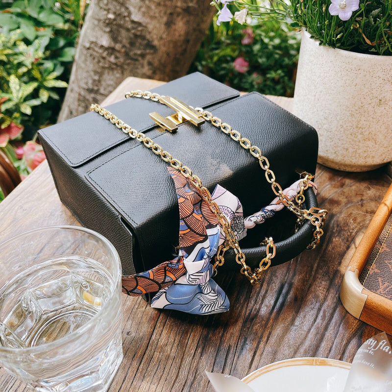Side view of clean-lined structured handbag