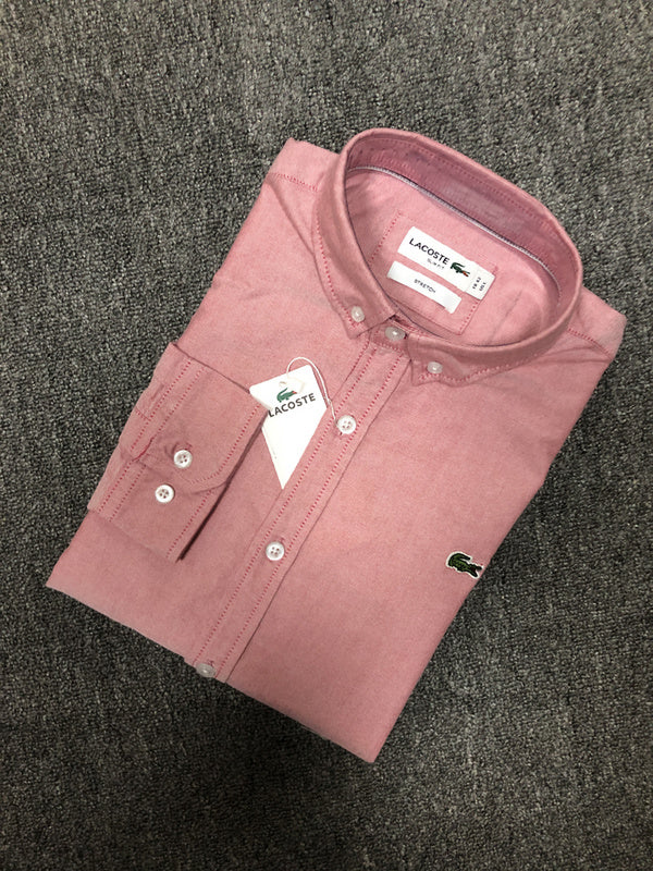Side profile of Lacoste luxury clothing with logo-detail design