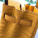 Side view of poised structured handbag