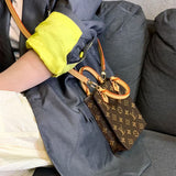  Signature satchel carried on shoulder 10