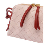 Close-up of Bottega Veneta clutches hardware and fine stitching