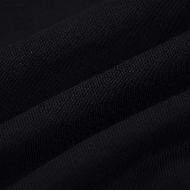 Close-up detail shot of Louis Vuitton luxury clothing with signature branding