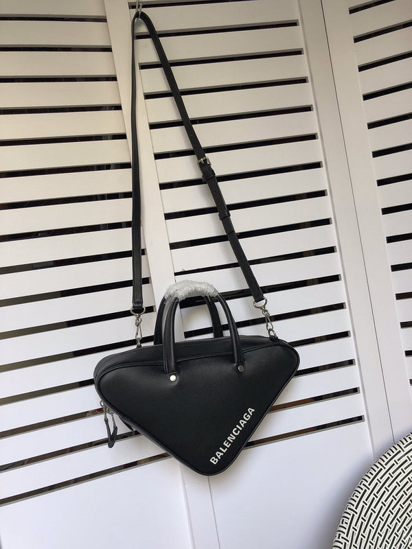 Side profile of refined signature women's handbag – women's luxury handbag
