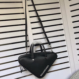 Side profile of refined signature women's handbag – women's luxury handbag
