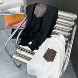 Close-up detail shot of Louis Vuitton luxury clothing with runway-inspired design
