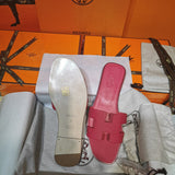 Hermès Nude Flat Thong Sandals - Lifestyle Styling Shot