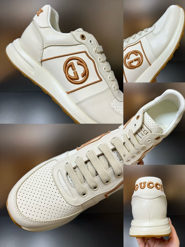 Side profile of Gucci two-tone sneakers signature lace-up style