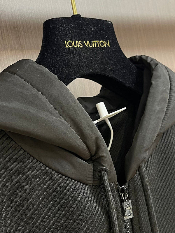 Close-up detail shot of Louis Vuitton luxury clothing with monogram-inspired silhouette