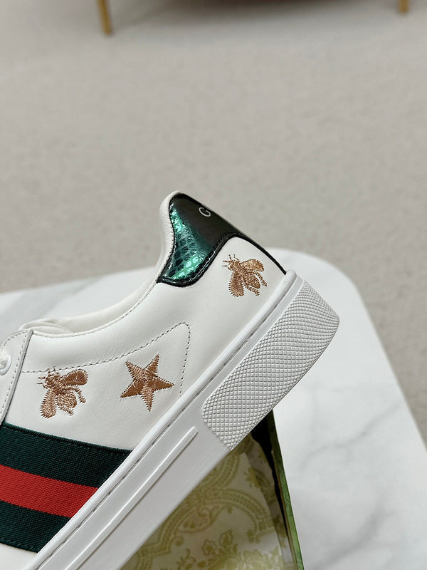 Side profile of Gucci soft grey sneakers bold athletic profile