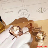 Lifestyle view of Van Cleef & Arpels unisex jewelry piece