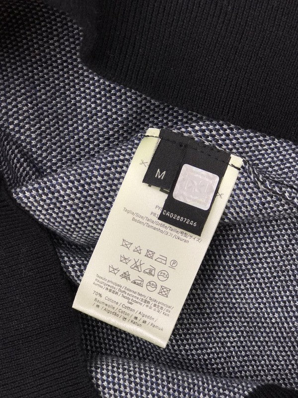 Back view of Louis Vuitton luxury clothing with streetwear-inspired cut