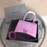Side profile of statement modern women's handbag – women's luxury accessory