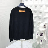 Back view of Louis Vuitton luxury clothing with signature branding