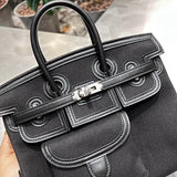 Side view of graceful structured handbag