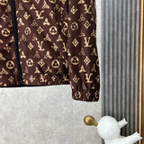 Close-up detail shot of Louis Vuitton luxury clothing with label-forward styling