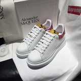 Alexander McQueen fresh white-and-black luxury sneakers view 4 signature lace-up style