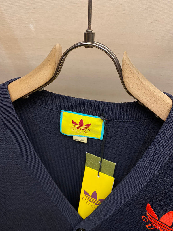 Close-up detail shot of Gucci luxury clothing with label-forward styling