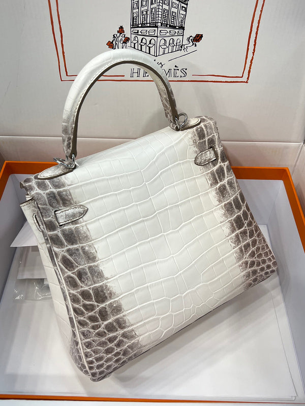 Side view of poised structured handbag
