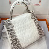 Side view of poised structured handbag