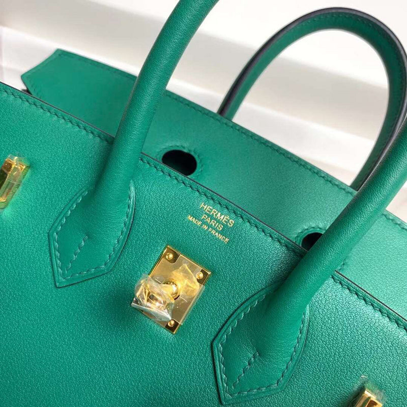 Side view of tailored structured handbag