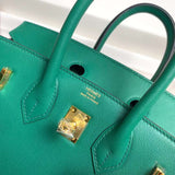 Side view of tailored structured handbag