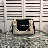 Side profile of chic everyday-luxe women's handbag – women's luxury handbag