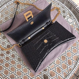 Front view of structured modern women's handbag – women's luxury accessory
