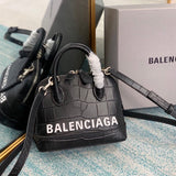 Polished Premium PU Leather Handbag - Smooth Faux-Leather Exterior | Women's Premium Handbag #655 - side angle view (image 2) of designer-inspired handbag