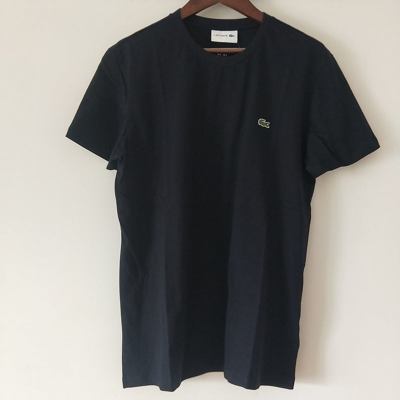 Flat lay presentation of Lacoste luxury clothing with logo-detail design