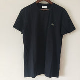 Flat lay presentation of Lacoste luxury clothing with logo-detail design