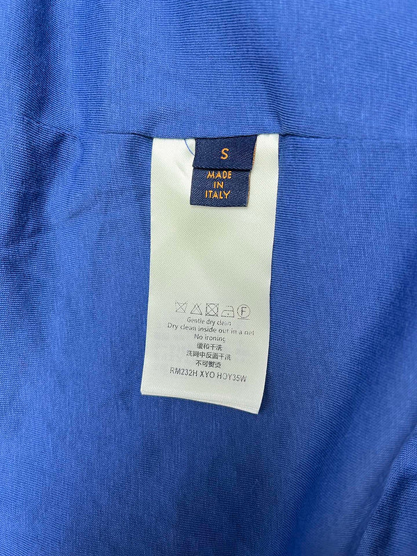 Close-up detail shot of Louis Vuitton luxury clothing with logo-detail design