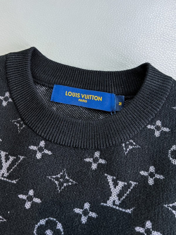 Flat lay presentation of Louis Vuitton luxury clothing with monogram-inspired silhouette
