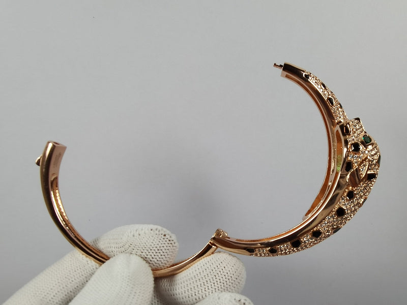 Close-up detail view of Cartier unisex jewelry piece