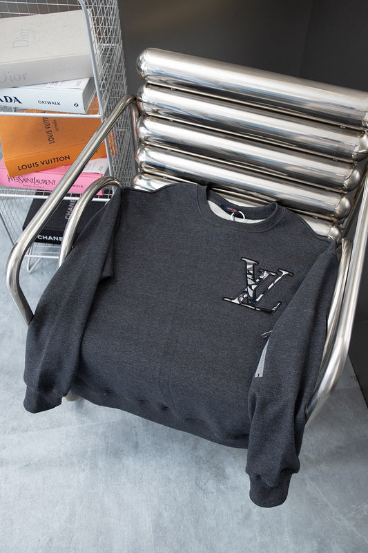 Close-up detail shot of Louis Vuitton luxury clothing with relaxed-fit cut