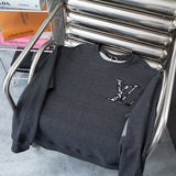 Close-up detail shot of Louis Vuitton luxury clothing with relaxed-fit cut