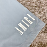 Three-quarter angle view of Amiri luxury piece style No.079